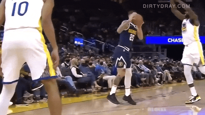 Draymond greens hits Austin Rivers in the chest with a flying knee.