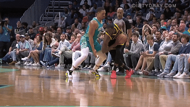 draymond green kicks towards grant williams balls